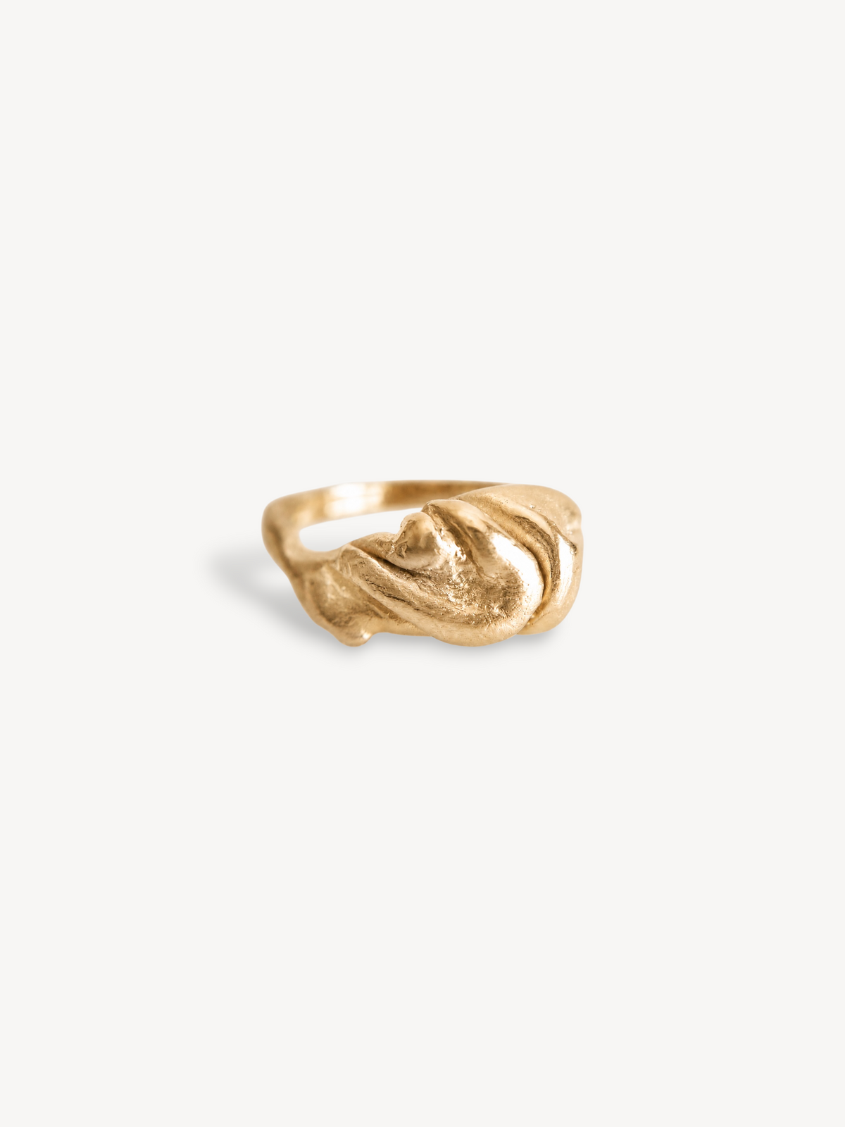 Three-quarter view of a handcrafted 14k gold-plated sterling silver sculptural ring.