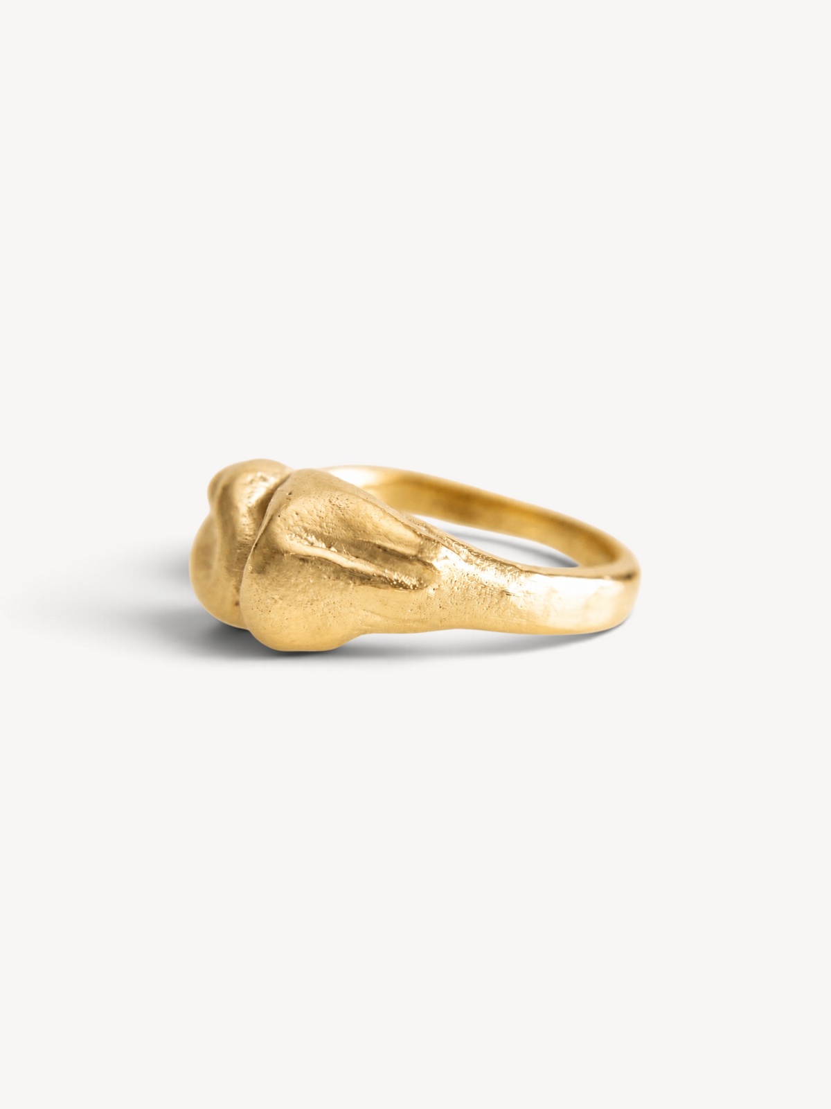 Side profile of a handcrafted 14k gold-plated sterling silver sculptural ring.