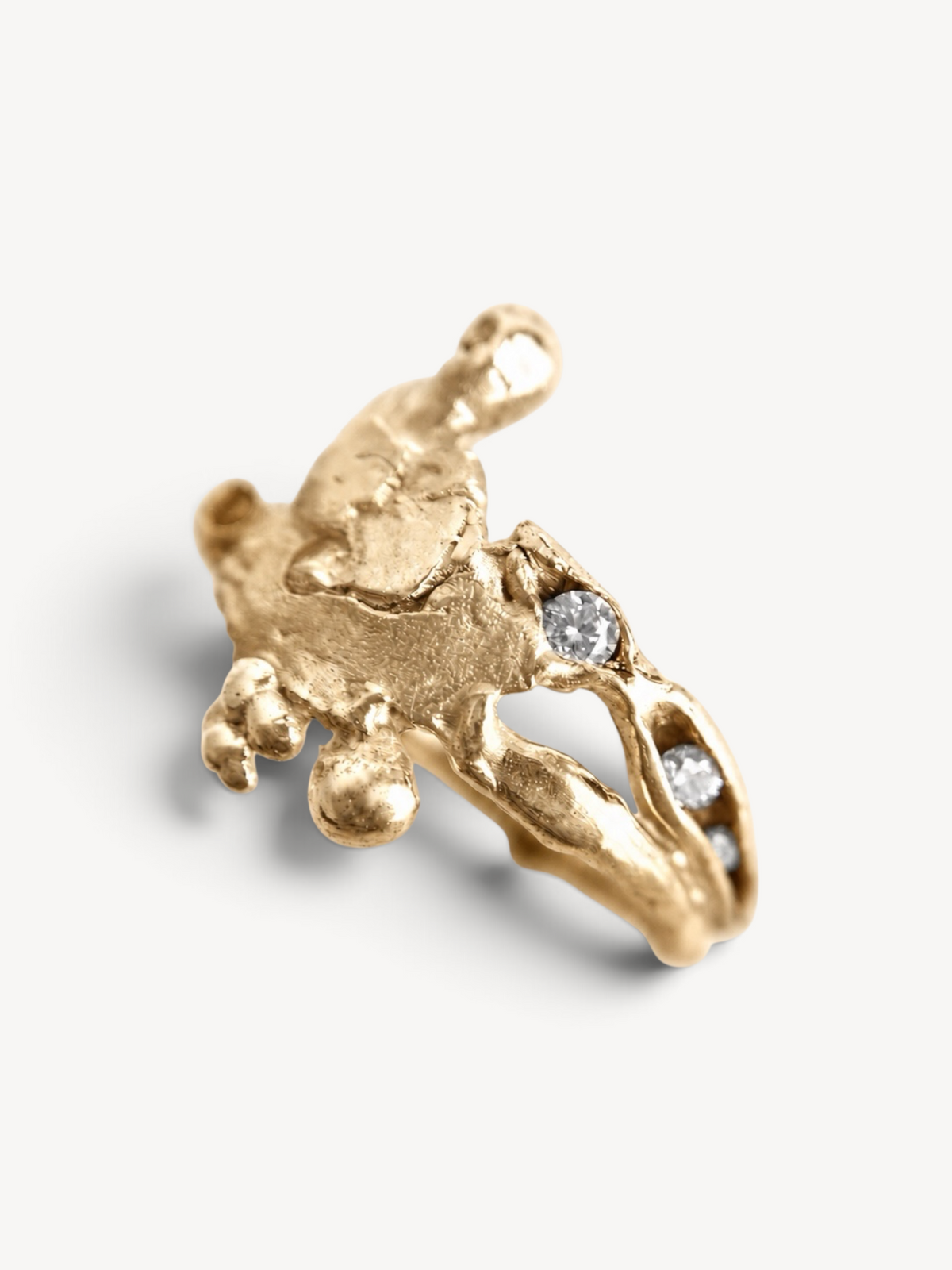 Contemporary 14k gold plated sterling silver ring featuring an organic sculptural form and six white zircon stones.