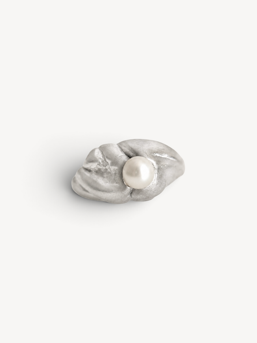 Top view of a handcrafted rhodium-plated sterling silver pearl ring with a contemporary organic form.